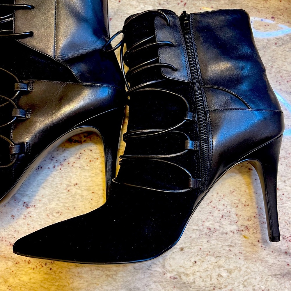 Black suede and leather boots. Laces all the way up. Zipper on the side.